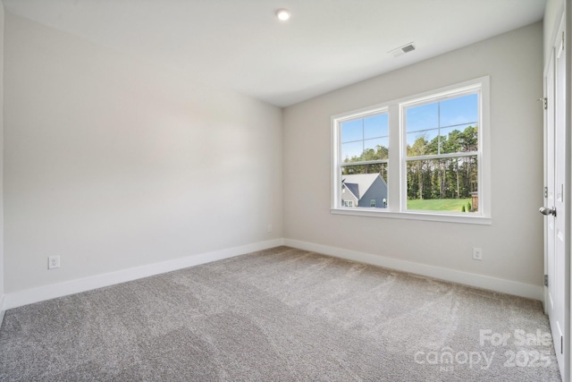 unfurnished room with carpet flooring