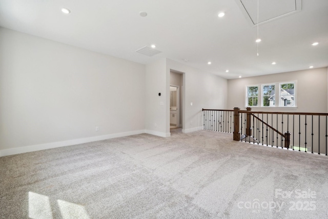 empty room featuring light carpet