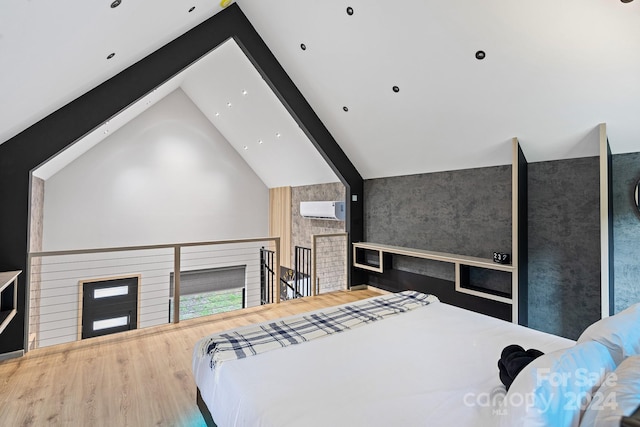 bedroom with wood-type flooring, a wall unit AC, and lofted ceiling with beams