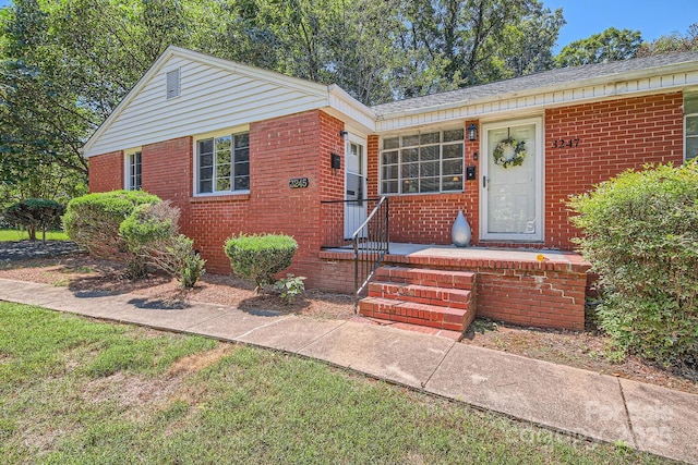 view of front of property featuring brick siding