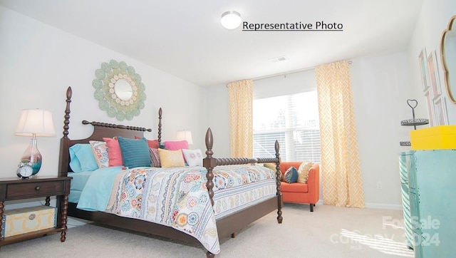 bedroom with light colored carpet