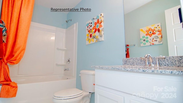 full bathroom featuring toilet, vanity, and shower / washtub combination