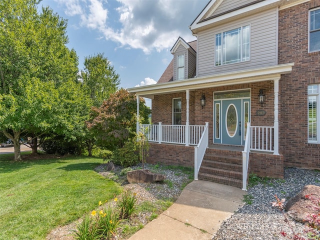 view of front of property with a front lawn and a porch