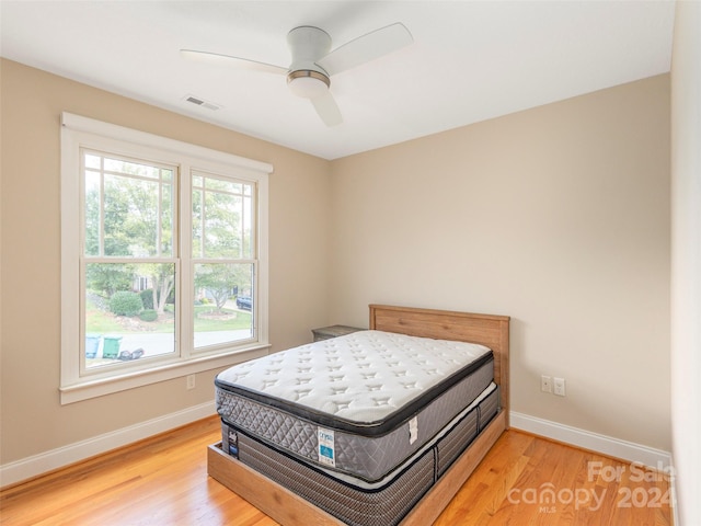 bedroom featuring light wood-type flooring and ceiling fan