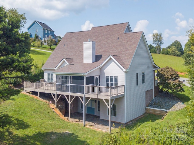 209 Velvet Ln, Weaverville, NC 28787 - back of house featuring a wooden deck, a chimney, a lawn, and roof with shingles