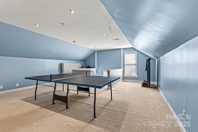 game room with carpet flooring, vaulted ceiling, and baseboards