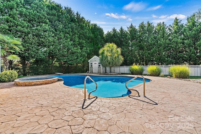 view of pool featuring a fenced backyard, an outdoor structure, and a patio