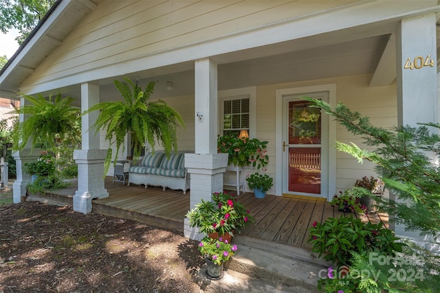 doorway to property featuring covered porch