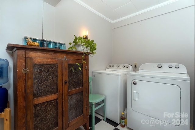 404 Montreat Rd, Black Mountain, NC 28711 - laundry room with crown molding, washing machine and clothes dryer, and cabinet space