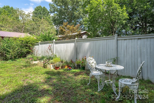 404 Montreat Rd, Black Mountain, NC 28711 - view of yard featuring a garden and a fenced backyard