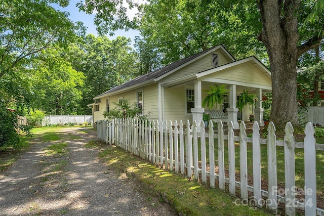 404 Montreat Rd, Black Mountain, NC 28711 - view of side of home featuring covered porch, driveway, and a fenced front yard