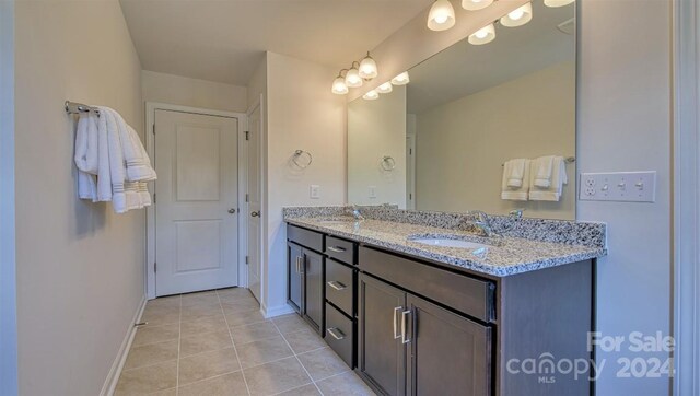 bathroom featuring tile patterned floors and vanity