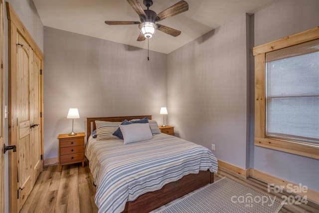 bedroom featuring ceiling fan and light hardwood / wood-style flooring