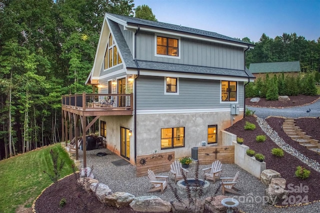 back of property featuring central AC unit and a patio