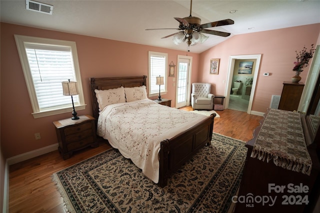 bedroom featuring hardwood / wood-style flooring, multiple windows, and ceiling fan