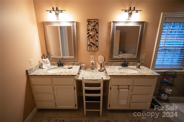 bathroom with tile patterned flooring and vanity