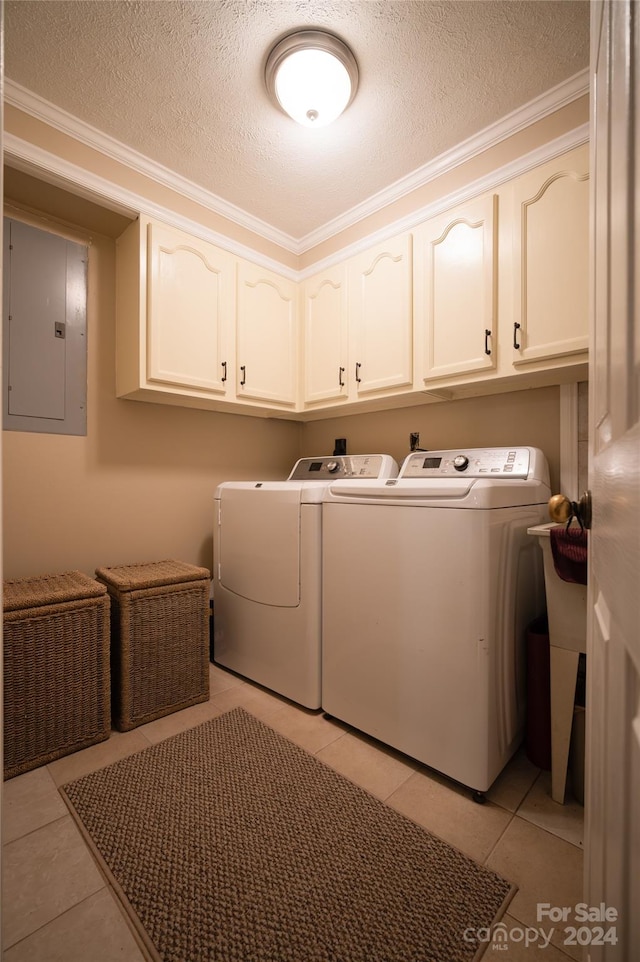 laundry room with cabinets, separate washer and dryer, electric panel, crown molding, and a textured ceiling