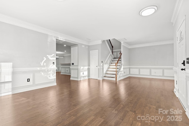 unfurnished living room with crown molding and hardwood / wood-style floors