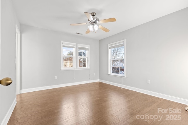 unfurnished room featuring ceiling fan and hardwood / wood-style floors