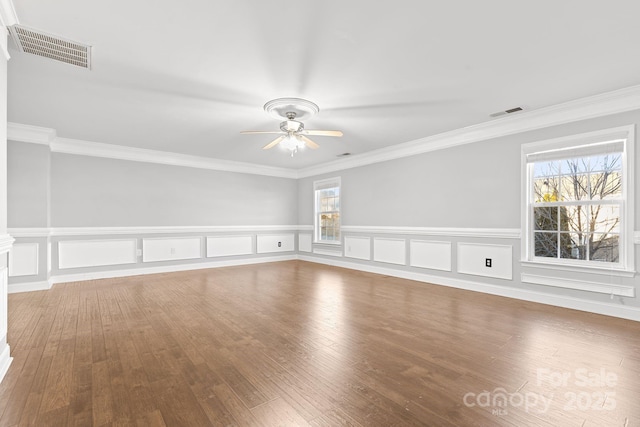 unfurnished room with ceiling fan, crown molding, and plenty of natural light