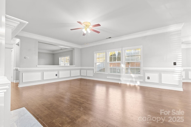 unfurnished living room with ceiling fan, hardwood / wood-style flooring, and crown molding