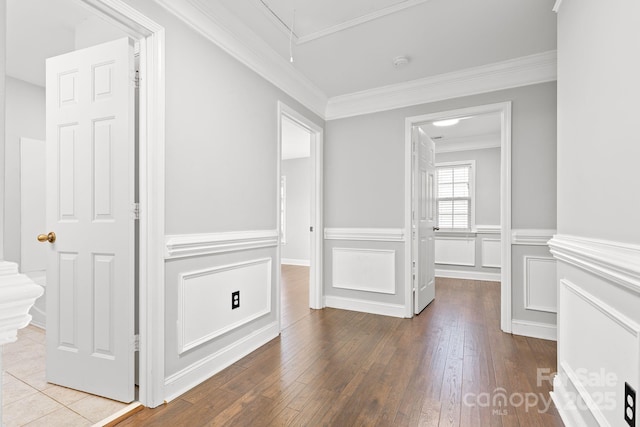 interior space with wood-type flooring and ornamental molding