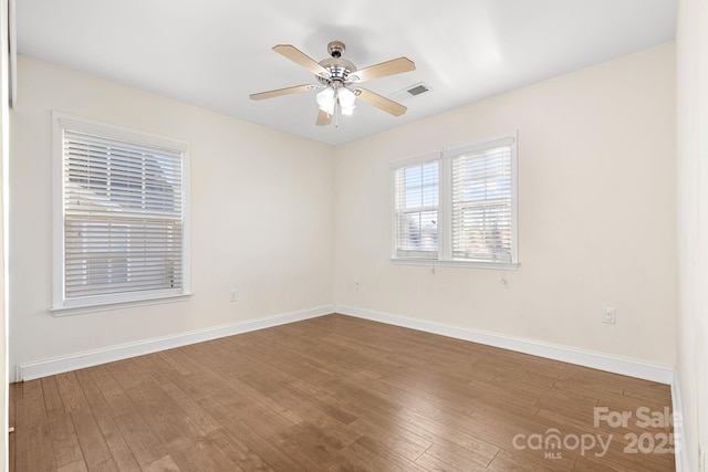 unfurnished room featuring ceiling fan and wood-type flooring