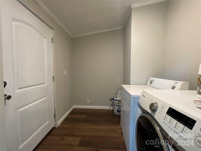 clothes washing area with crown molding, baseboards, dark wood finished floors, laundry area, and independent washer and dryer