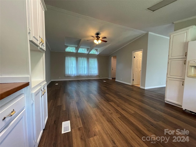 unfurnished living room with dark wood-style floors, visible vents, a ceiling fan, and ornamental molding