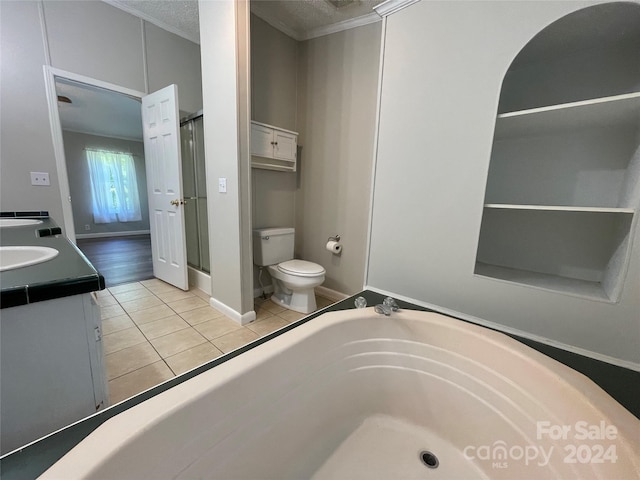 bathroom featuring tile patterned flooring, toilet, ornamental molding, a stall shower, and a bath