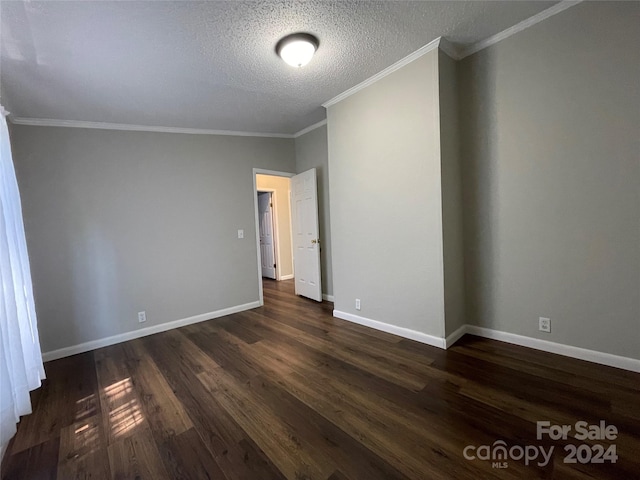 unfurnished room featuring baseboards, a textured ceiling, ornamental molding, and dark wood-style flooring