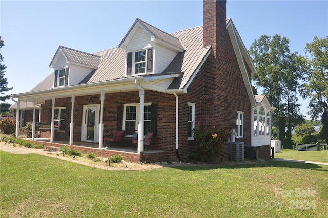 120 Old Belwood Rd, Lawndale, NC 28090 - exterior space featuring cooling unit, a yard, covered porch, brick siding, and a chimney