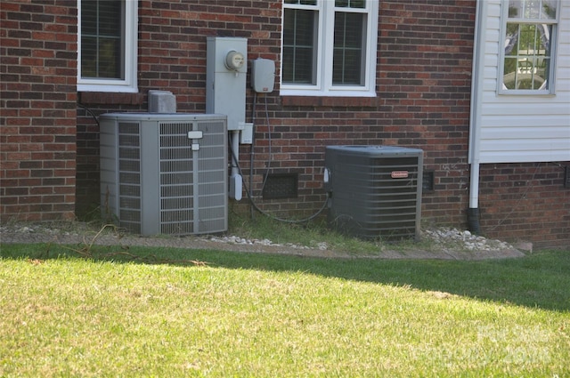 120 Old Belwood Rd, Lawndale, NC 28090 - details with electric meter, central AC unit, and brick siding
