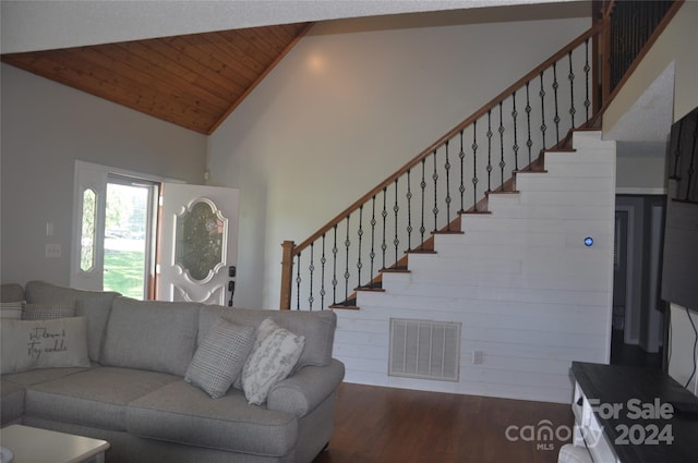 living room with dark hardwood / wood-style flooring, high vaulted ceiling, wooden walls, and wood ceiling