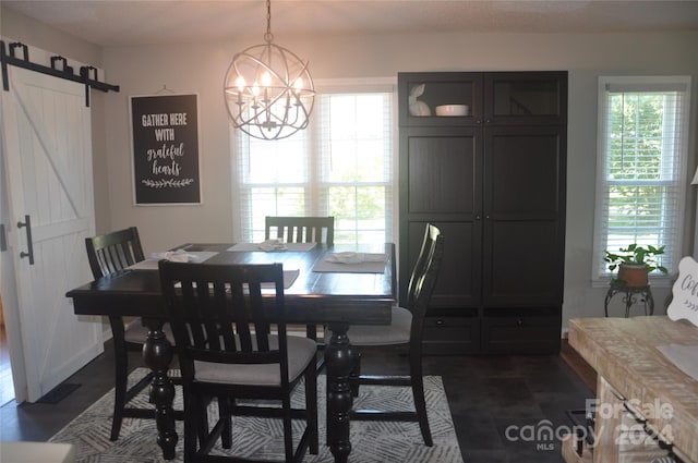 tiled dining area with a notable chandelier and a barn door