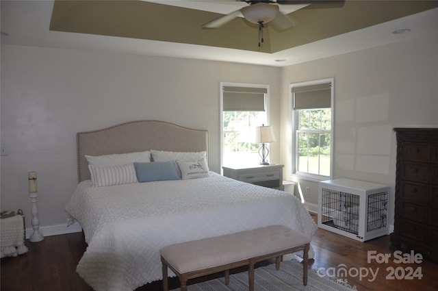 bedroom with ceiling fan and dark hardwood / wood-style floors