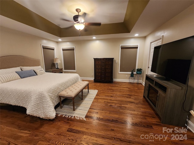 120 Old Belwood Rd, Lawndale, NC 28090 - bedroom with baseboards, a raised ceiling, a fireplace, recessed lighting, and wood finished floors
