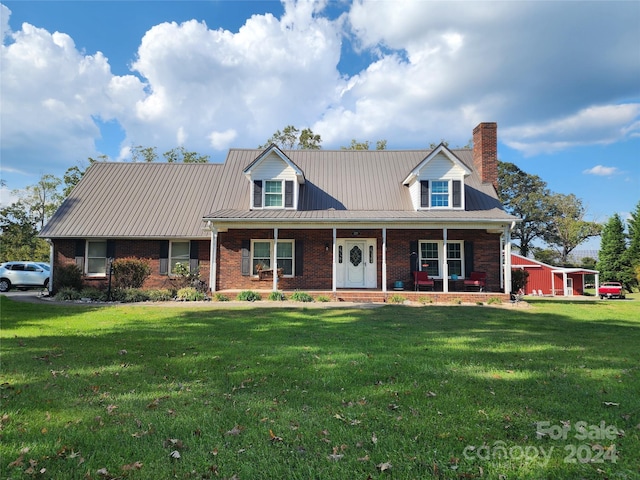 new england style home with a front lawn and a porch