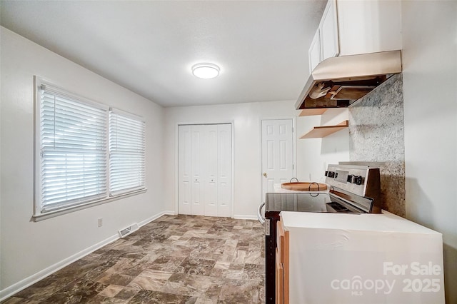 kitchen featuring white cabinetry and stainless steel electric stove