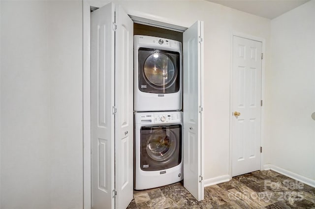 laundry room with stacked washer and clothes dryer