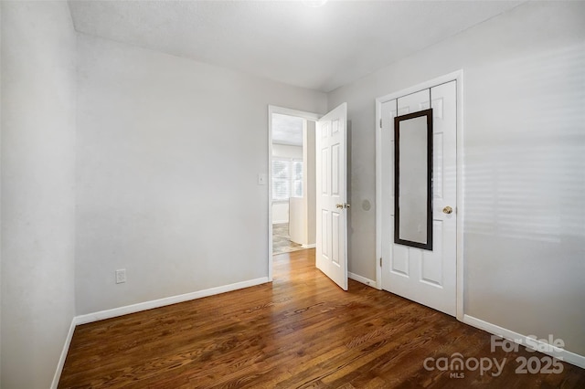 unfurnished room with hardwood / wood-style floors