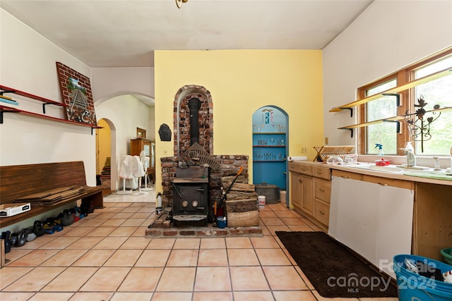 tiled living room with a wood stove