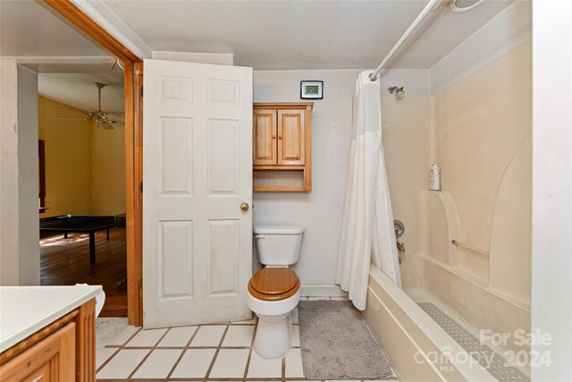 full bathroom featuring toilet, vanity, ceiling fan, shower / tub combo with curtain, and hardwood / wood-style flooring