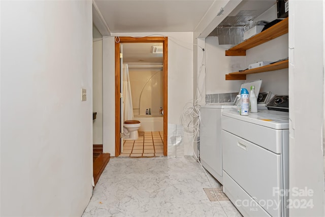 laundry room featuring laundry area and washing machine and dryer