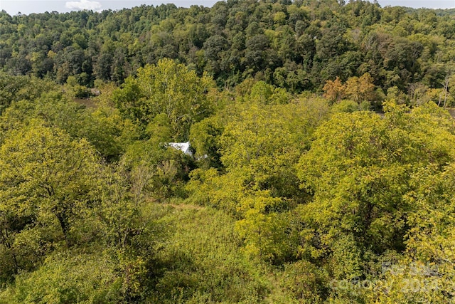 aerial view featuring a view of trees