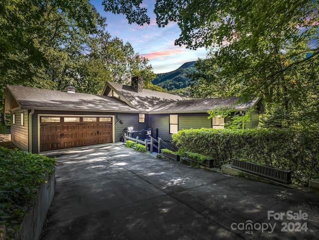 ranch-style home with a mountain view