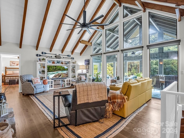 living room with high vaulted ceiling, ceiling fan, wood-type flooring, and beam ceiling