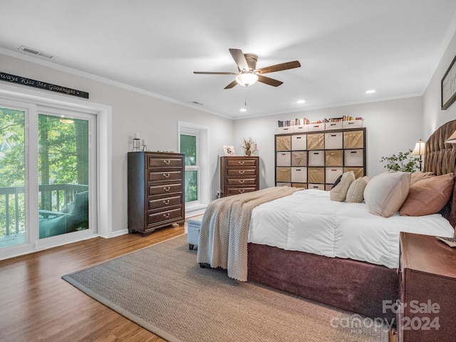 bedroom featuring ornamental molding, access to outside, hardwood / wood-style floors, and ceiling fan