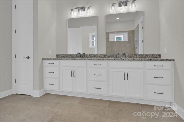 bathroom featuring tile patterned floors and vanity