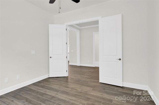 empty room featuring ceiling fan and hardwood / wood-style floors